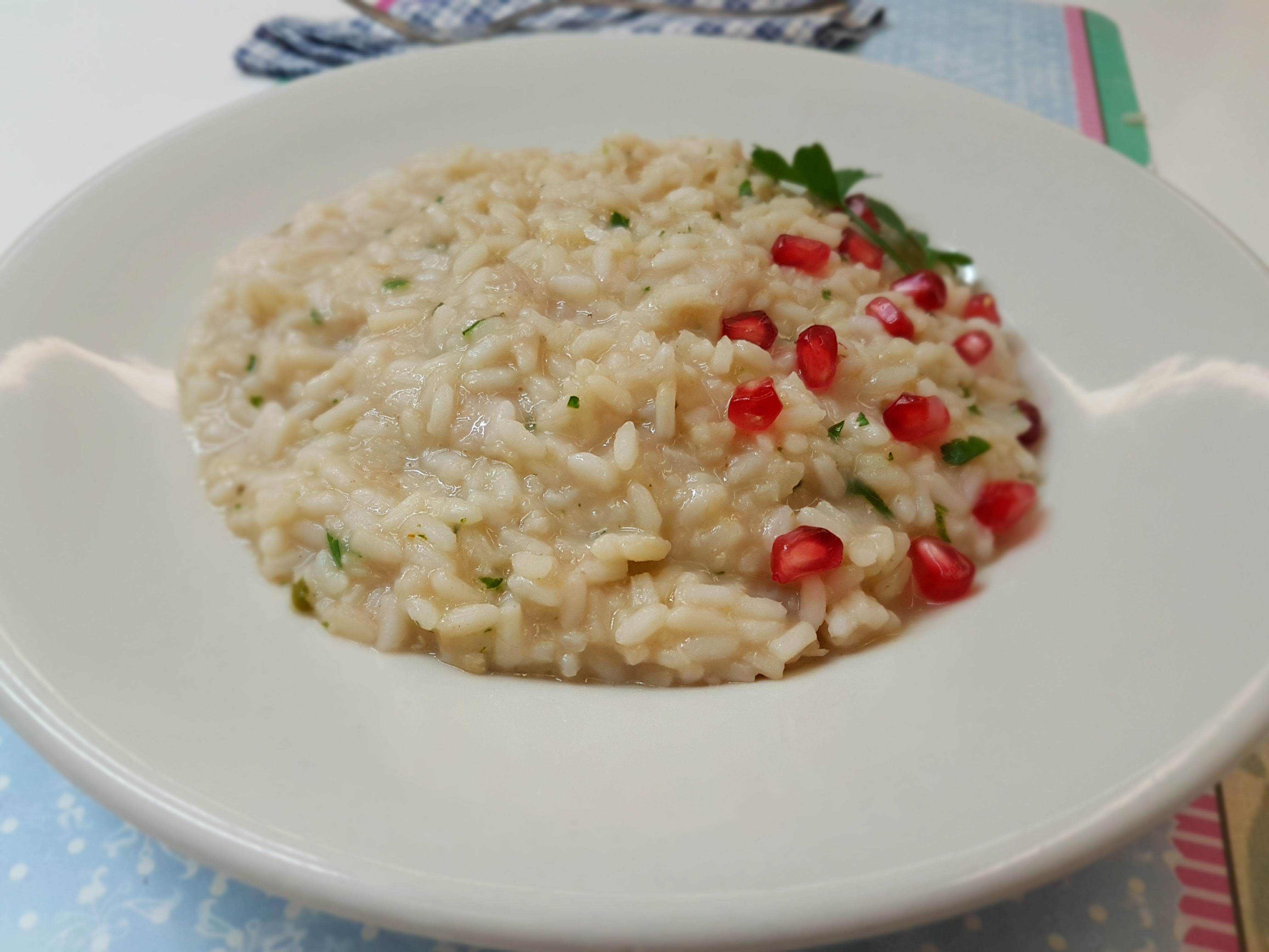 Risotto con baccalà mantecato al succo di melagrana